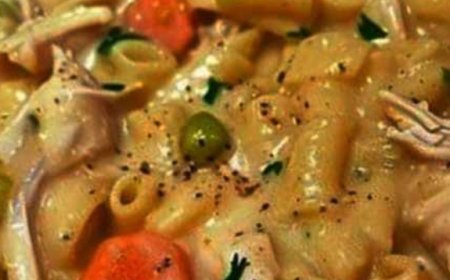 Skillet dish with chicken, noodles, and vegetables.