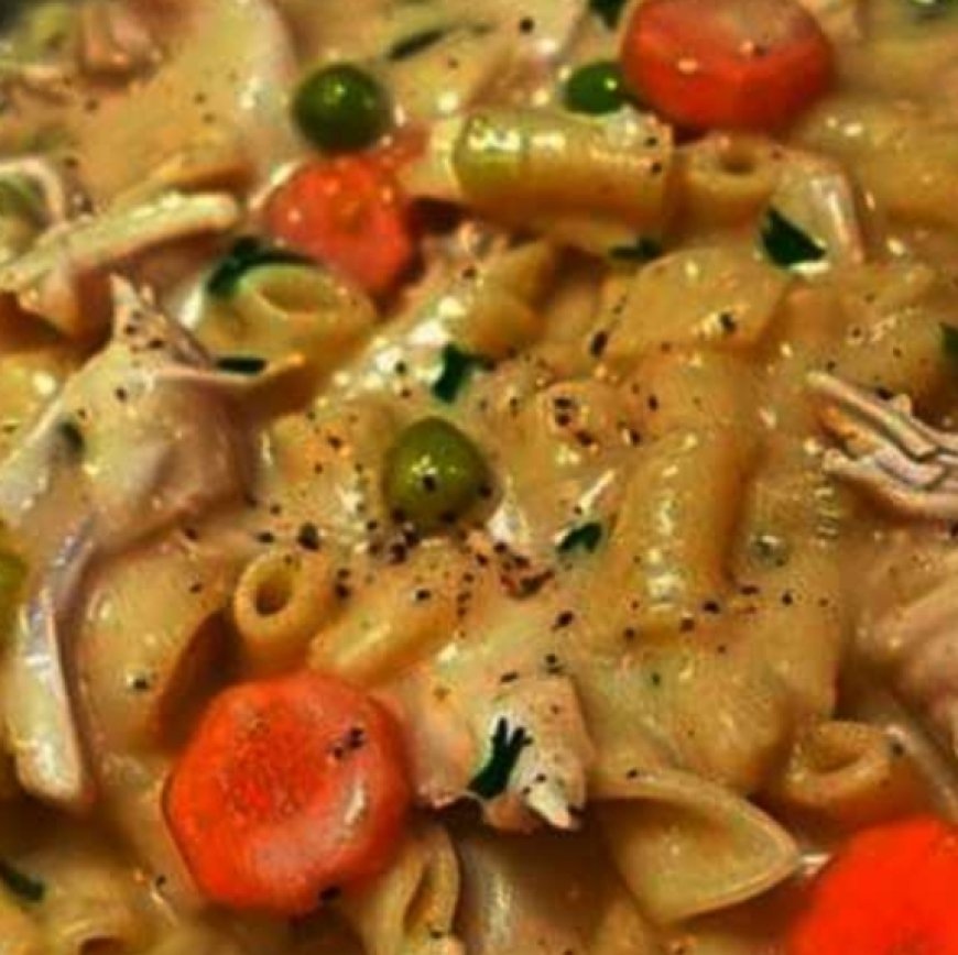 Skillet dish with chicken, noodles, and vegetables.
